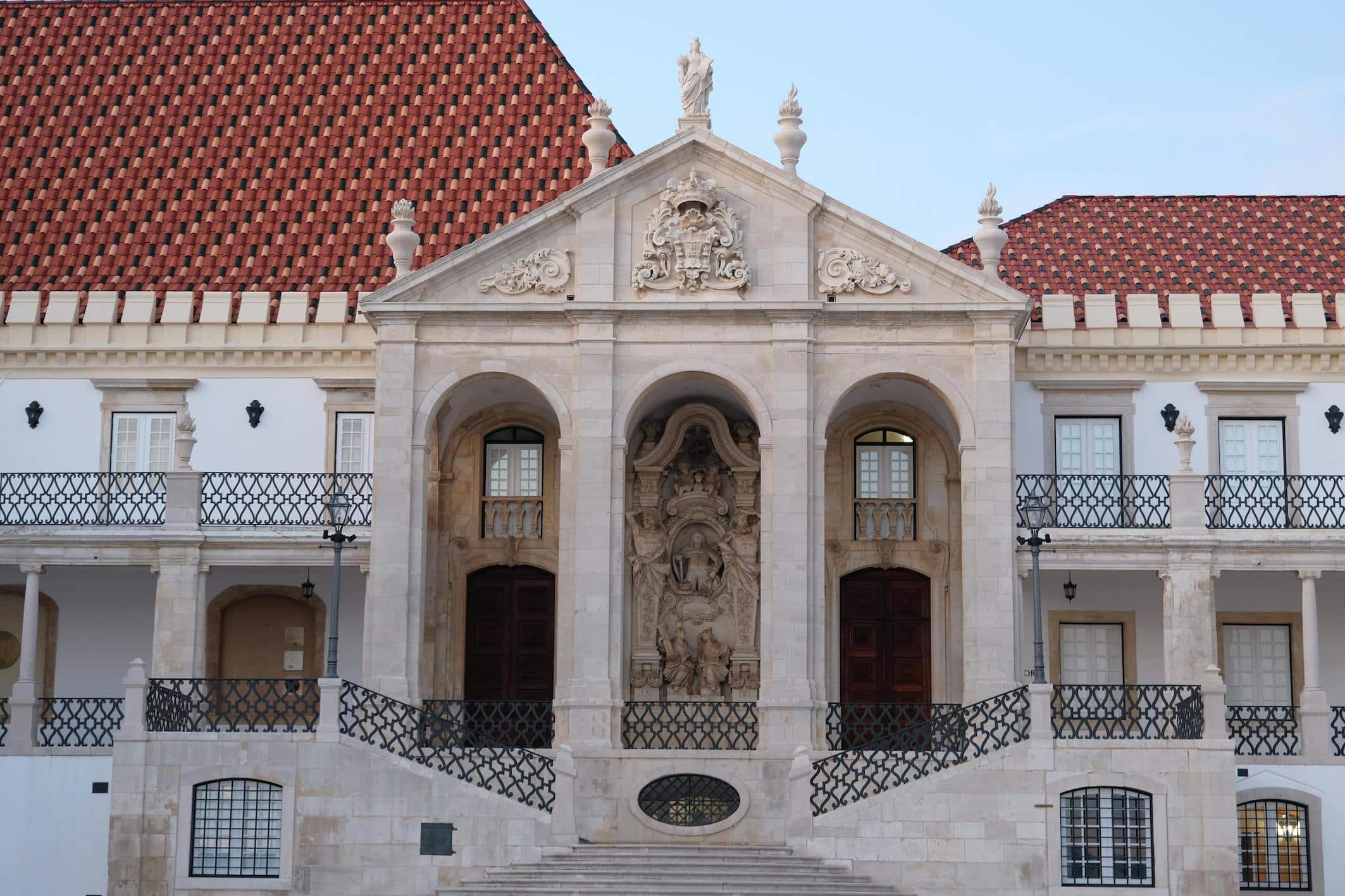 Facade of the University of Coimbra, Portugal, showcasing the historic architecture of one of the country's oldest and most prestigious universities.