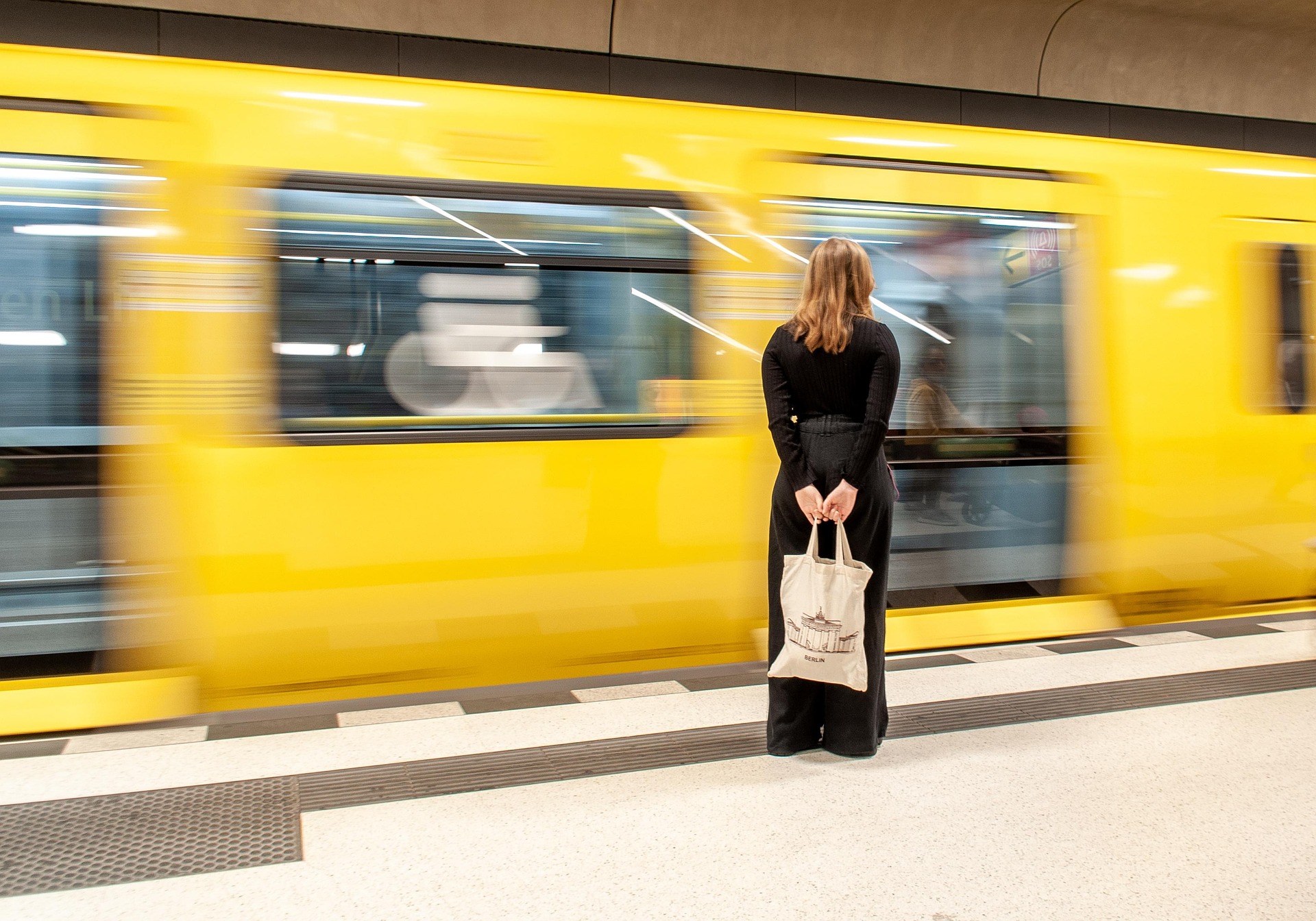 Passengers waiting at Coimbra-B train station, showcasing the city’s railway connections and public transport accessibility.