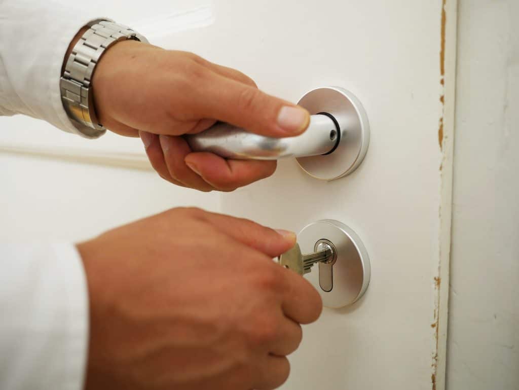 An inside door with a locker, symbolizing security and safety measures for renters and roommates to protect their belongings.