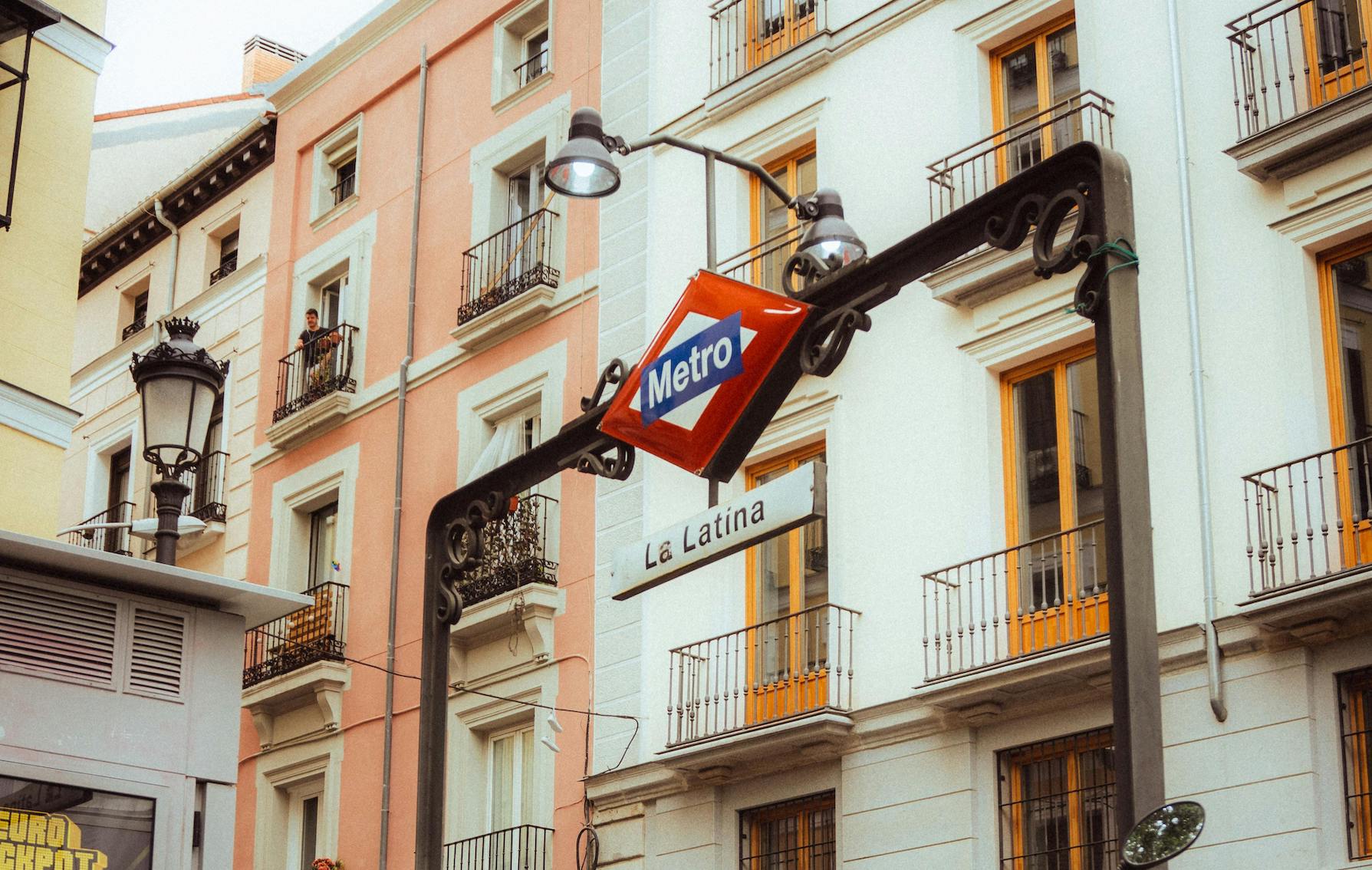 A bustling street scene in La Latina, Madrid, showcasing tapas bars, traditional architecture, and the neighborhood's authentic vibe.