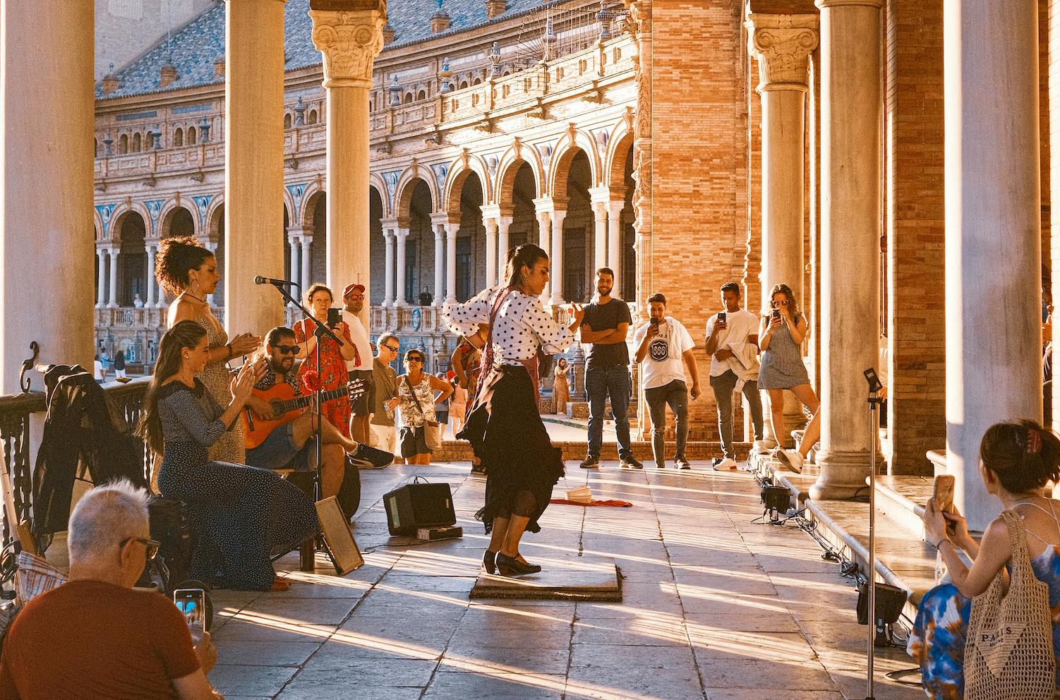 A vibrant Spanish festival with people celebrating, showcasing traditional customs expats should know.