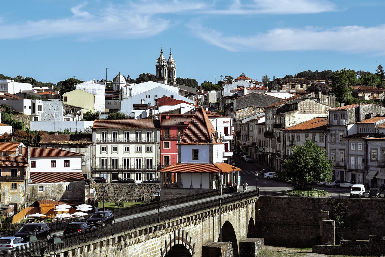 Colorful residential street in Maximinos, Braga, showcasing local shops and vibrant neighborhood life.