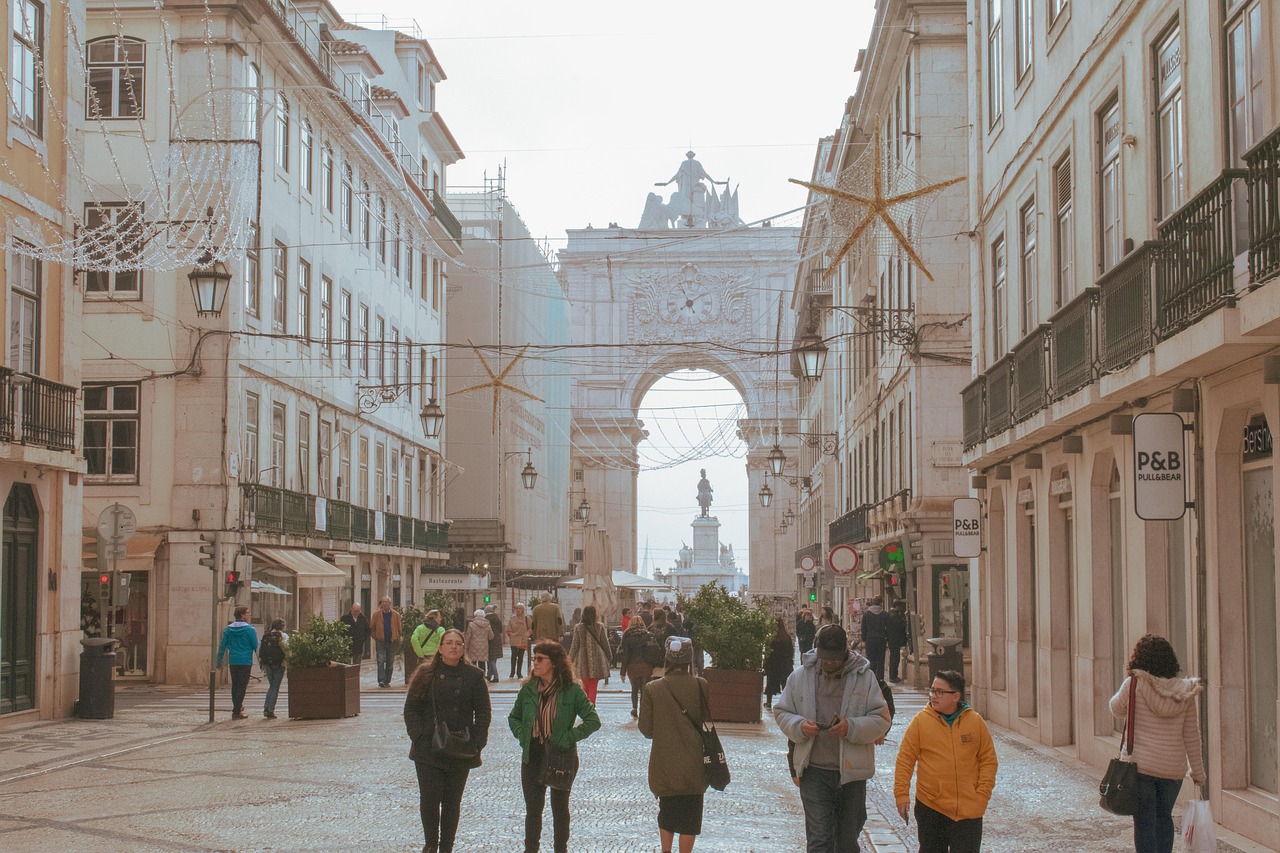 People shopping along the boutique-lined streets of Chiado in Lisbon, reflecting the neighborhood’s vibrant retail scene.
