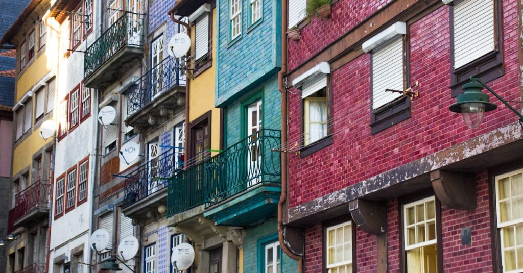 Vibrant, traditional multi-story buildings in Porto's historic district, reflecting the architectural charm and local character of the Bonfim neighborhood.