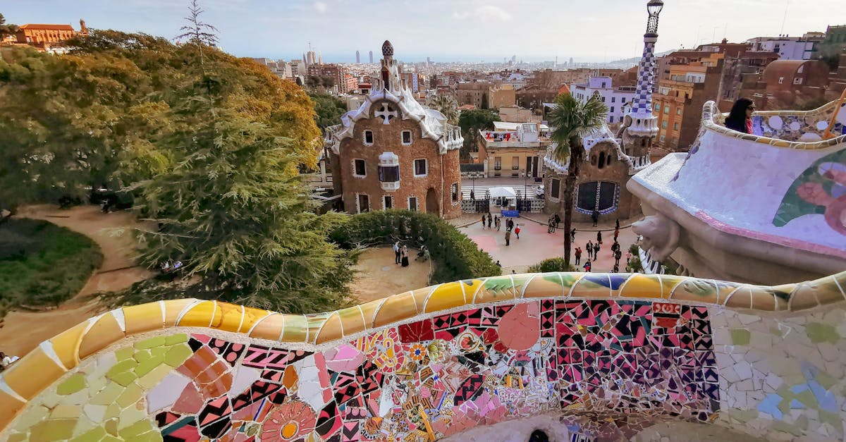 Park Güell in Barcelona with a view of the city and locals enjoying the surroundings.