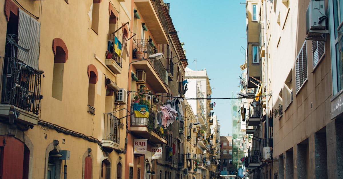 A cautious renter in Barcelona reviewing a lease agreement to avoid scams and hidden rental costs.