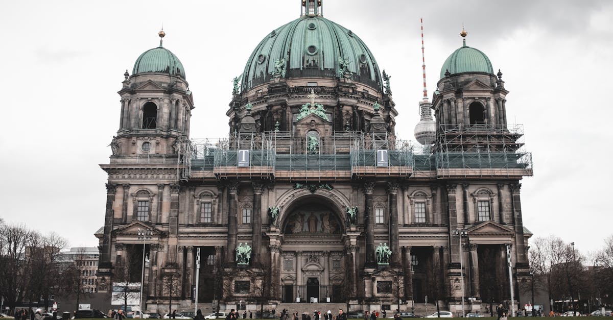 Front view of Berlin Cathedral (Berliner Dom) showcasing its iconic dome and facade with people in the foreground, representing Mitte as Berlin’s cultural epicenter.