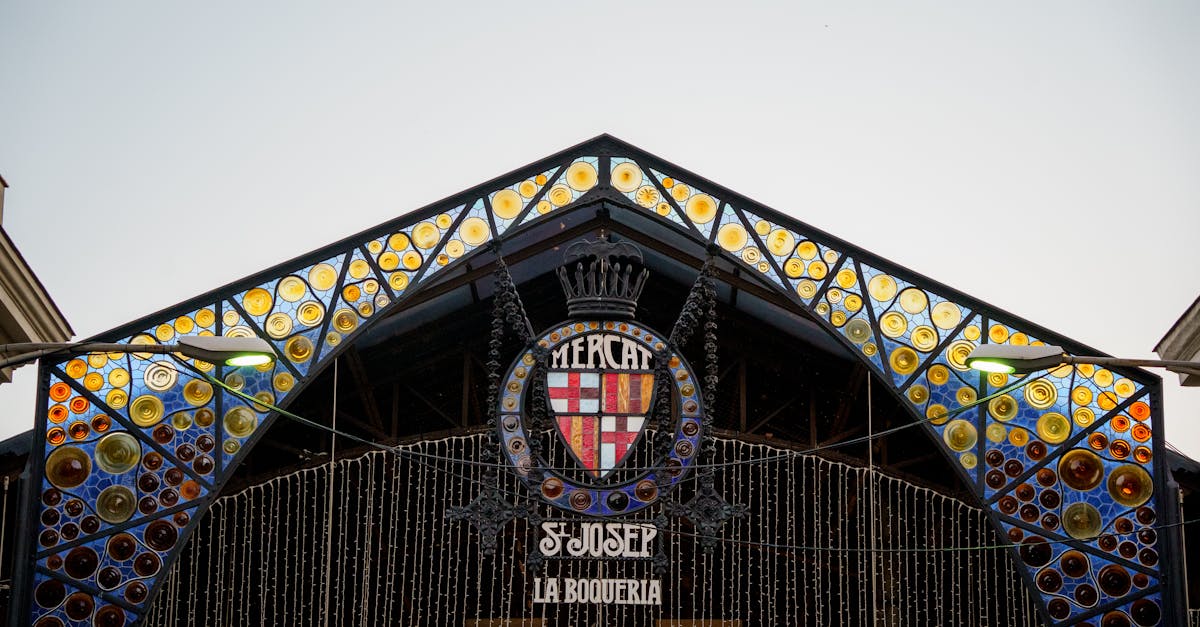 Vibrant facade of Mercat de Sant Josep de la Boqueria in El Raval, Barcelona, showcasing its colorful design.