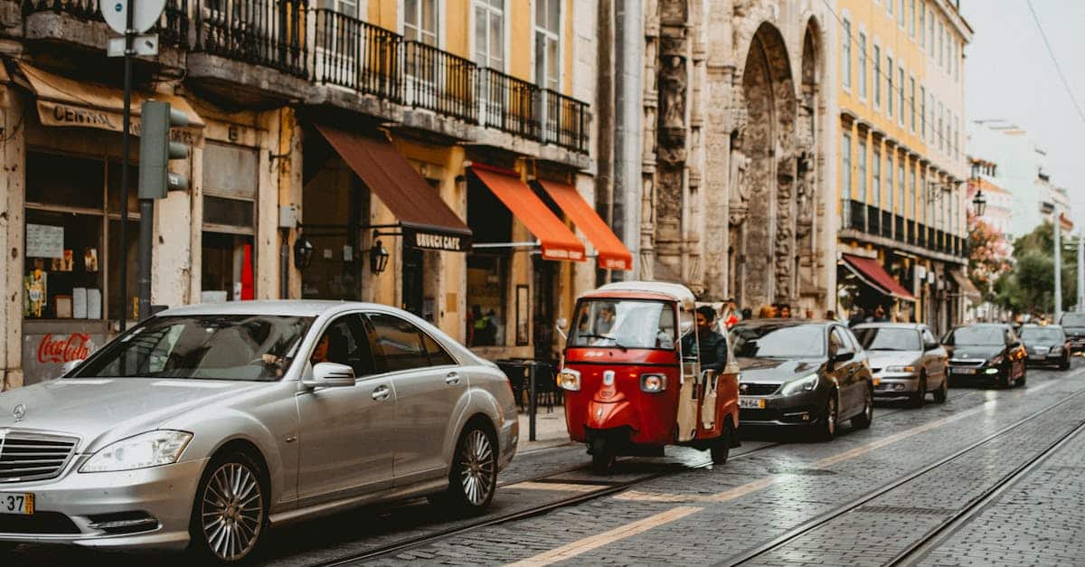 Urban scene showcasing traffic and historic architecture in Lisbon, highlighting the city’s transportation options and blend of modern living with cultural heritage.