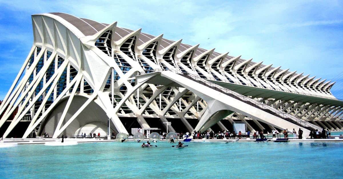 Futuristic City of Arts and Sciences in Valencia, featuring modern architecture, reflective water pools, and vibrant surroundings.