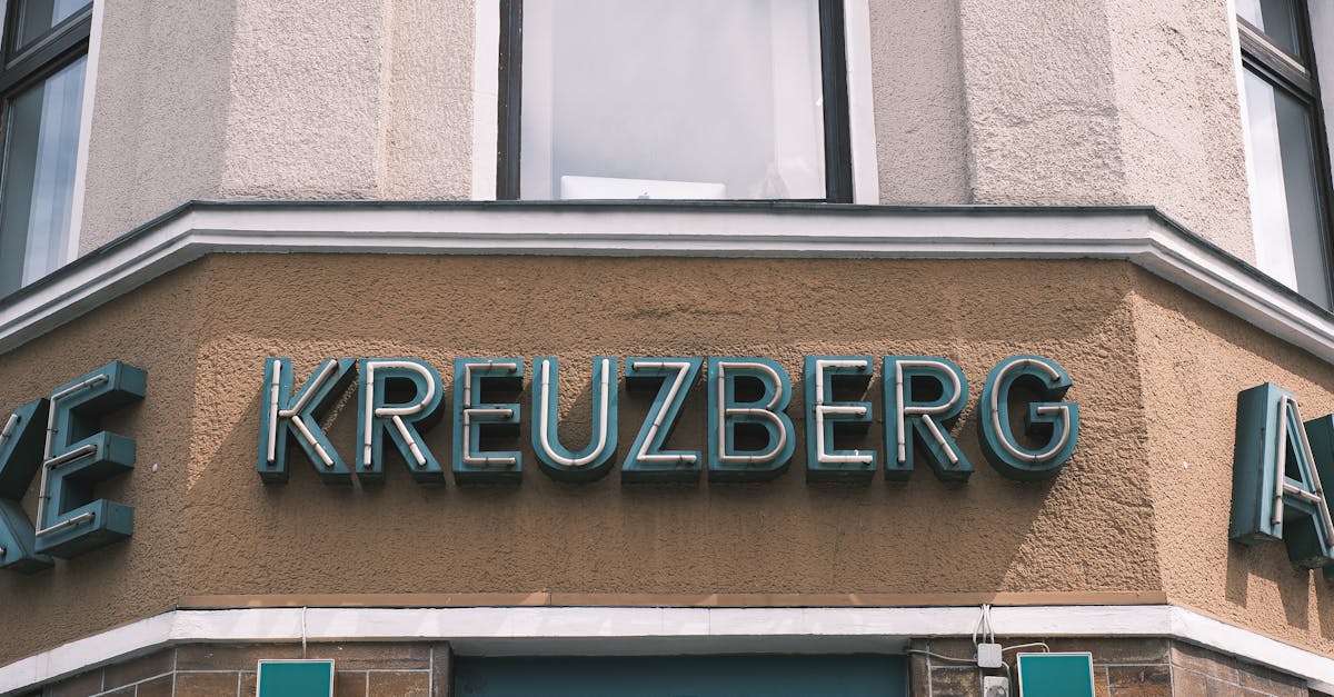 Close-up of a pharmacy facade with signage in Kreuzberg, Berlin, showcasing urban architecture and typography, representing healthcare access for expats.