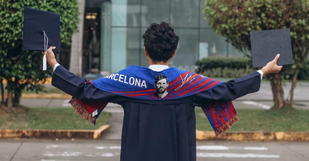 A university graduate celebrating with a Barcelona scarf, representing student life and academic achievements in Spain.