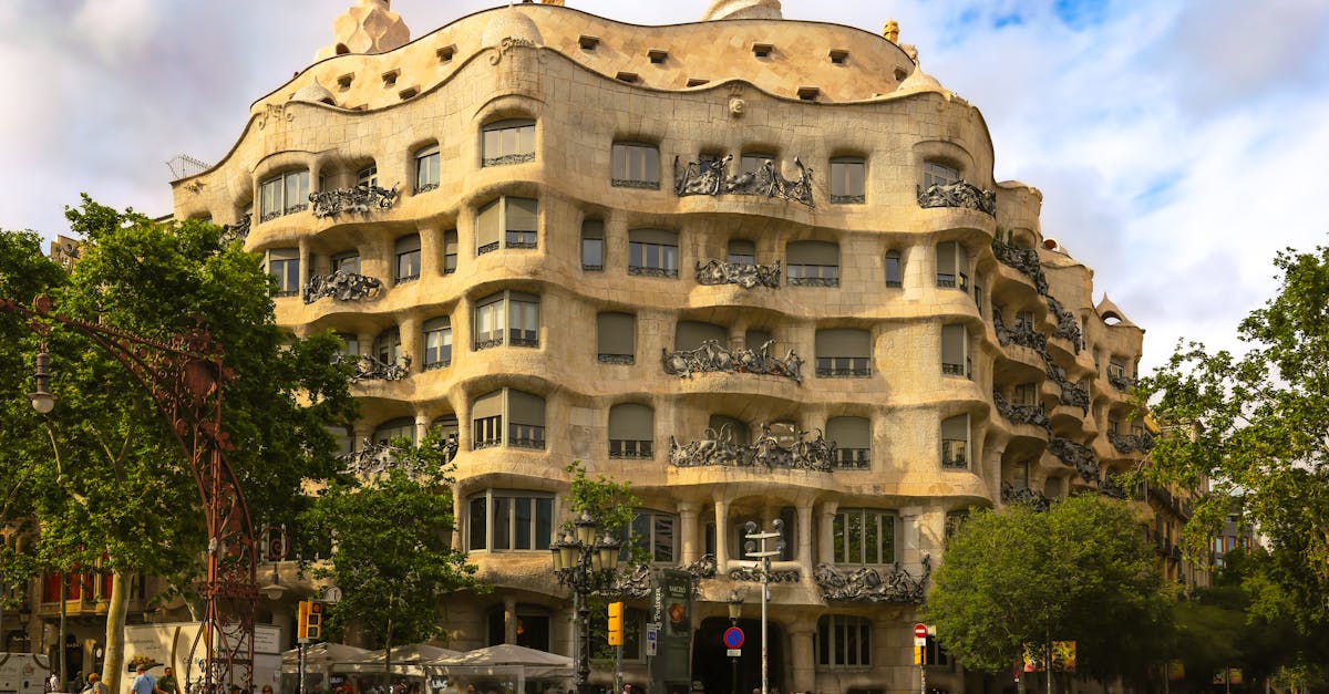 Stunning view of Casa Milà, Antoni Gaudí's iconic building in Eixample, Barcelona on a sunny day.