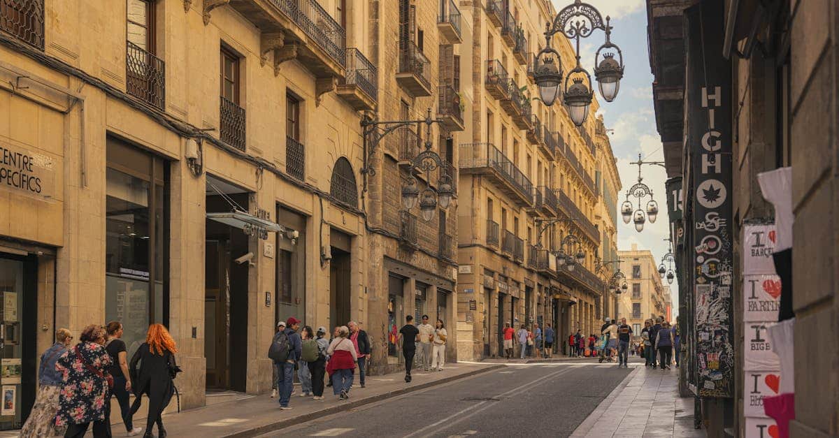 Bustling street in Barcelona's historic quarter with iconic street lamps and a crowd, showing the urban atmosphere and safety in public spaces for expats.