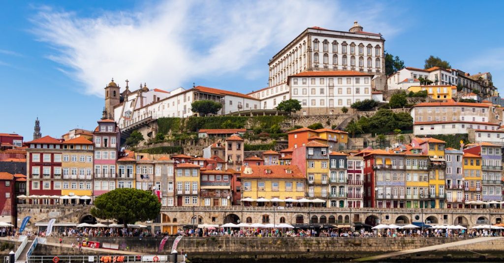 Colorful buildings lining the Ribeira waterfront in Porto, showcasing the neighborhood’s iconic charm along the Douro River.