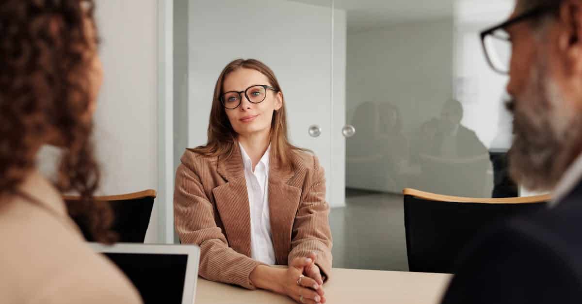 Young woman attending a job interview in a modern office in Portugal, showcasing professionalism and confidence for expats navigating the local job market.