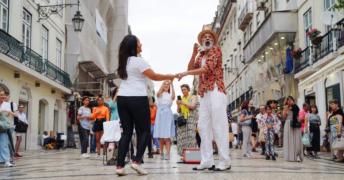 Man and woman performing a traditional dance in a Lisbon alley, highlighting Portuguese cultural traditions and social gatherings.