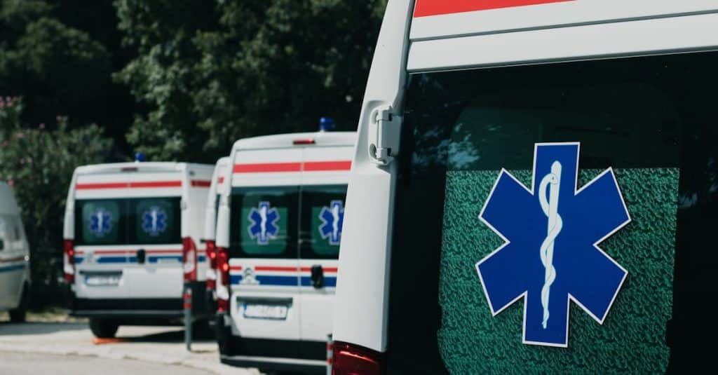 Three ambulances parked outdoors in Portugal, ready to provide emergency medical assistance to residents and expats.