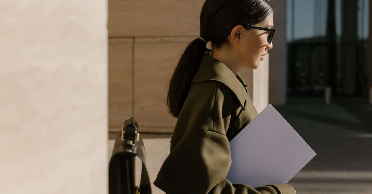 A professional woman standing outdoors holding a document, symbolizing job opportunities and career readiness in Spain.