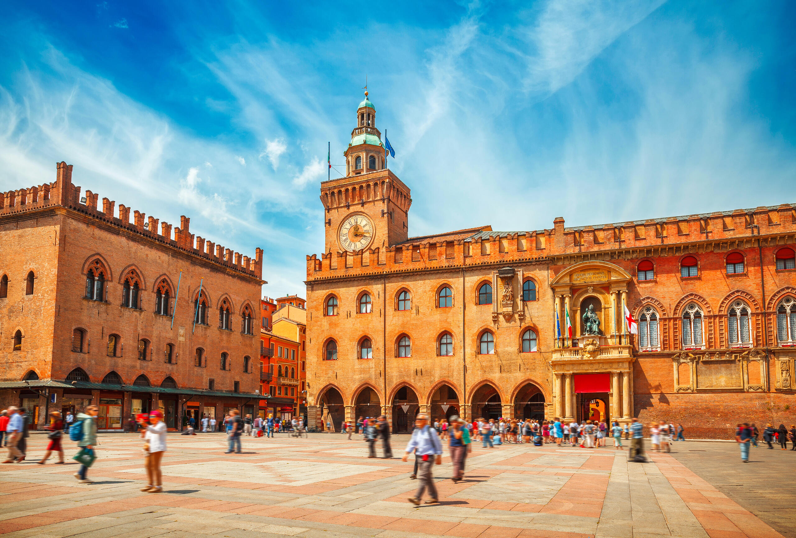 Piazza Maggiore in Bologna, Italy, featuring the historic Two Towers and the city's famous porticos.