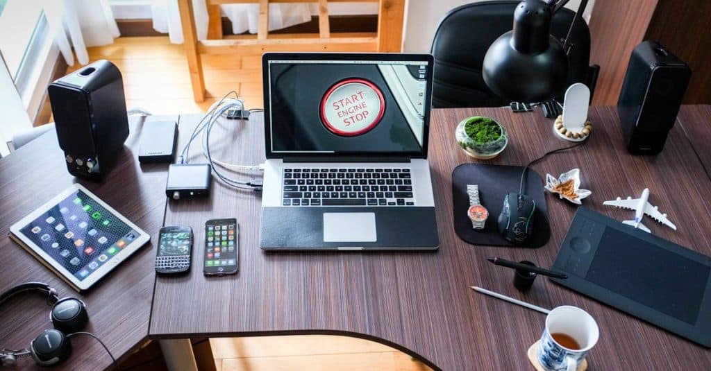 A contemporary office desk setup with laptops, gadgets, and accessories, creating a tech-savvy workplace.
