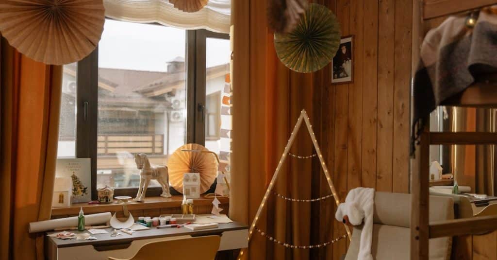 A warm wooden room interior featuring creative decor elements and natural light, showcasing budget-friendly DIY decor ideas for small spaces.