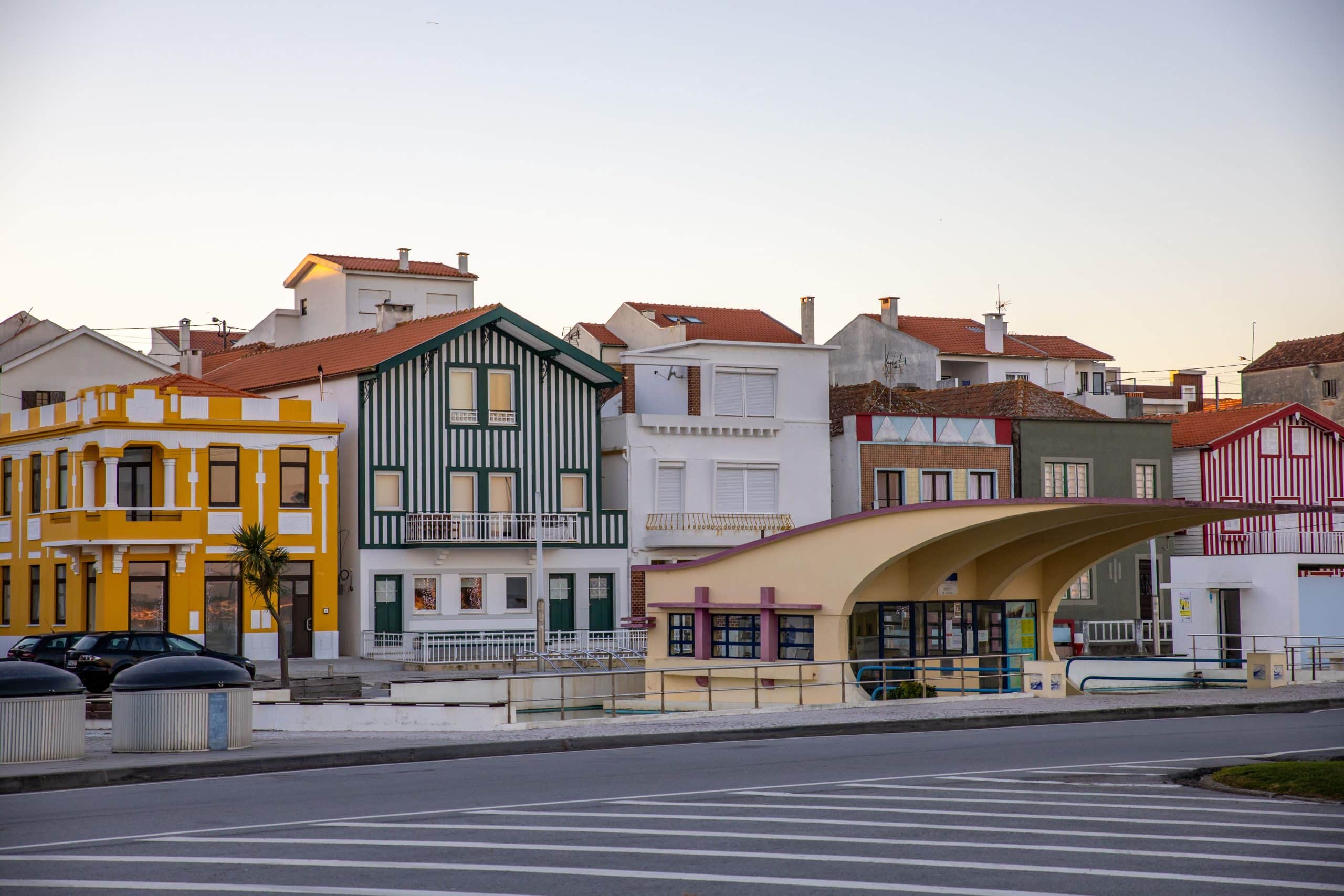 Colorful houses in Gafanha da Encarnação, Aveiro, Portugal captured in a serene daytime setting.
