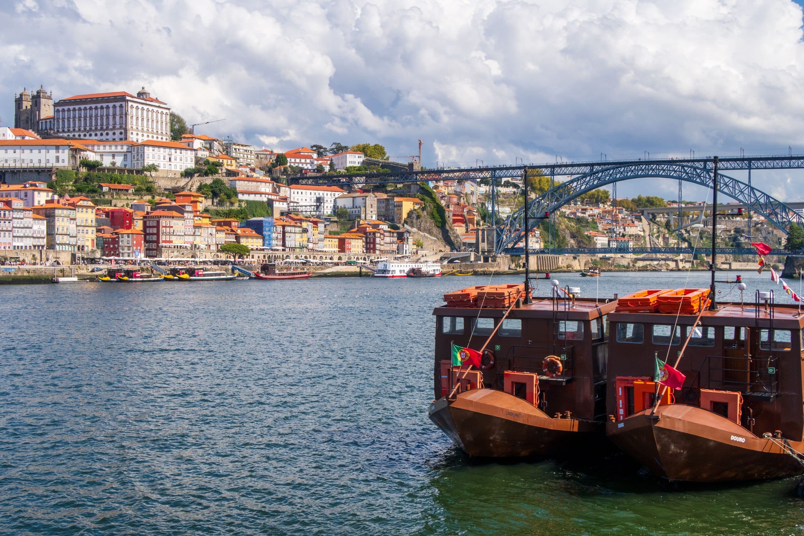 Beautiful cityscape of Oporto with the iconic Dom Luís I Bridge over the Douro River.