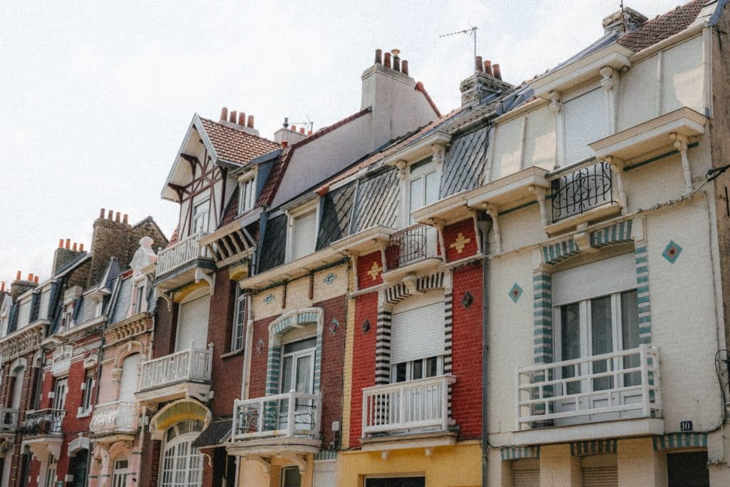 Colorful ornate facades of historic homes in Dunkerque, France, showcasing traditional architecture.