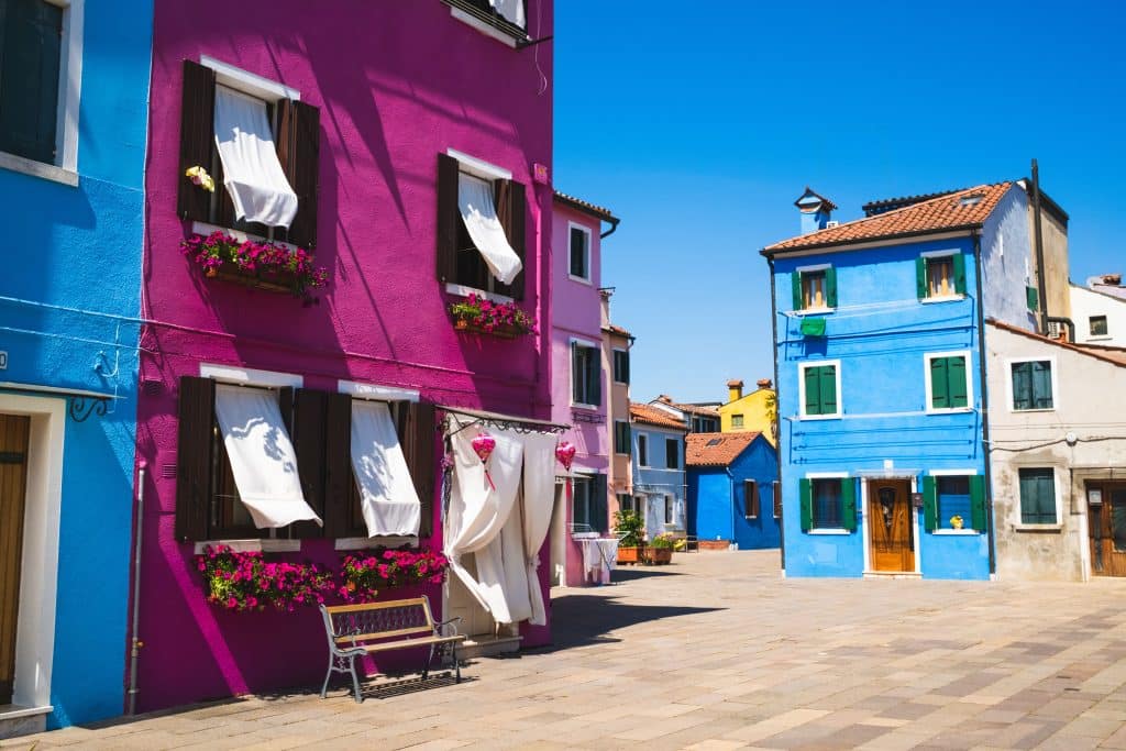 Brightly colored buildings in Burano, Italy, showcasing charming Venetian architecture.