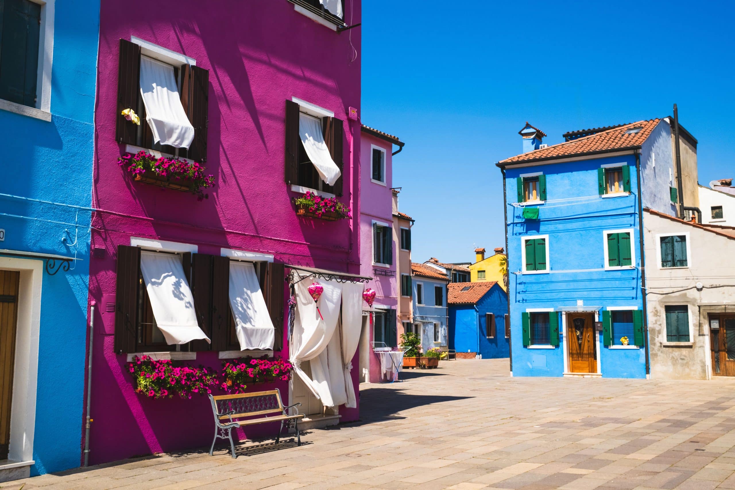 Brightly colored buildings in Burano, Italy, showcasing charming Venetian architecture.